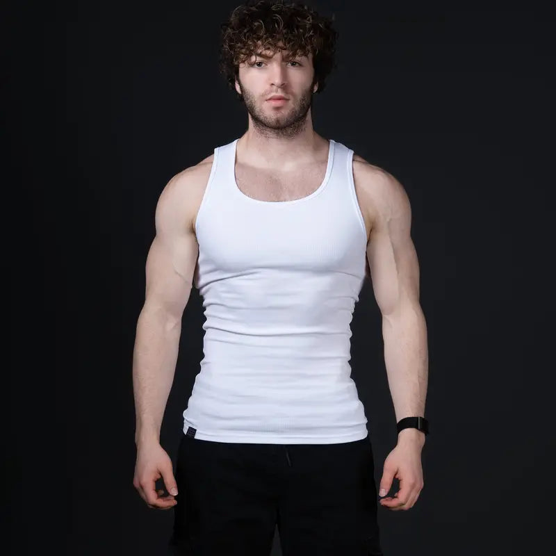 Men’s versatile tank top that smooths bulges and enhances a strong, athletic fit.