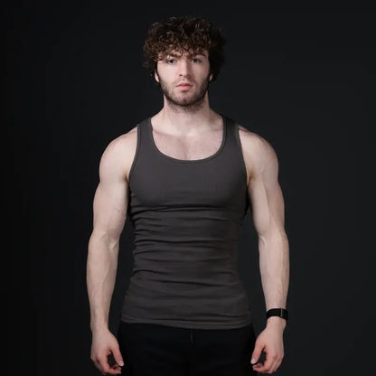 Men’s versatile tank top that smooths bulges and enhances a strong, athletic fit.
